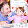 A smiling man and a young child are crafting with colorful chenille stem sticks on a white table.