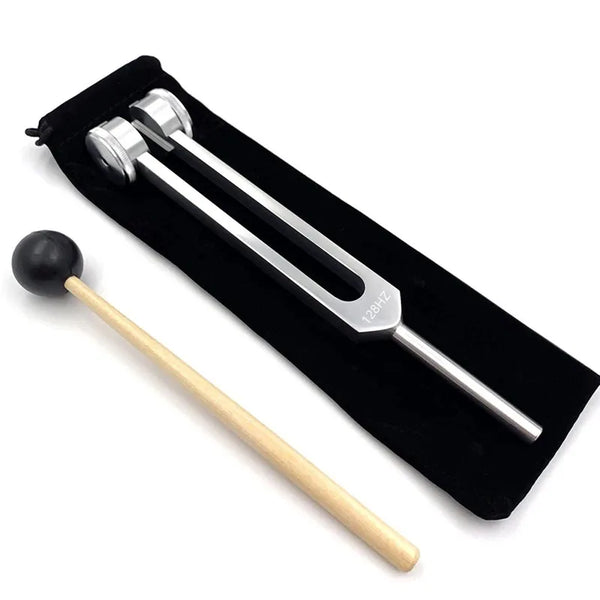 A pair of tuning forks, including a mallet, are displayed in a black case.