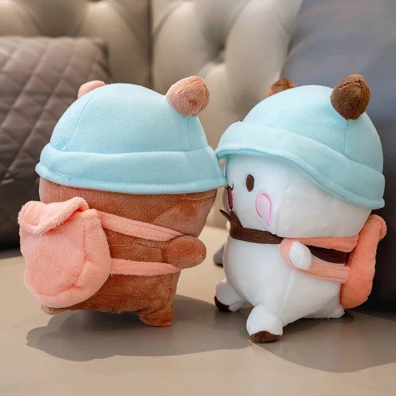 A cute panda bear plush toy wearing a light blue hat and orange accents.
