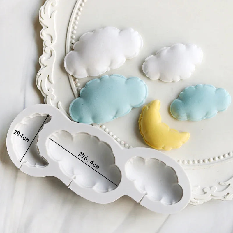 A silicone mold set featuring white and light blue clouds for baking and crafts
