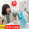 A child is playing with a blue shark toy, which is part of a prank board game set.