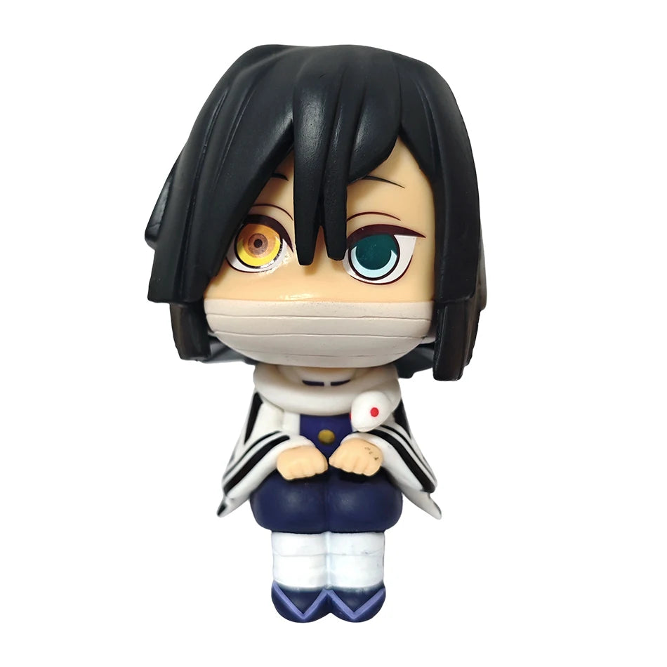Action figure of the Demon Slayer character Tanjirou with black hair and a white face mask.