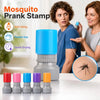 A set of self-inking mosquito prank stamps in various colors displayed on a white table.