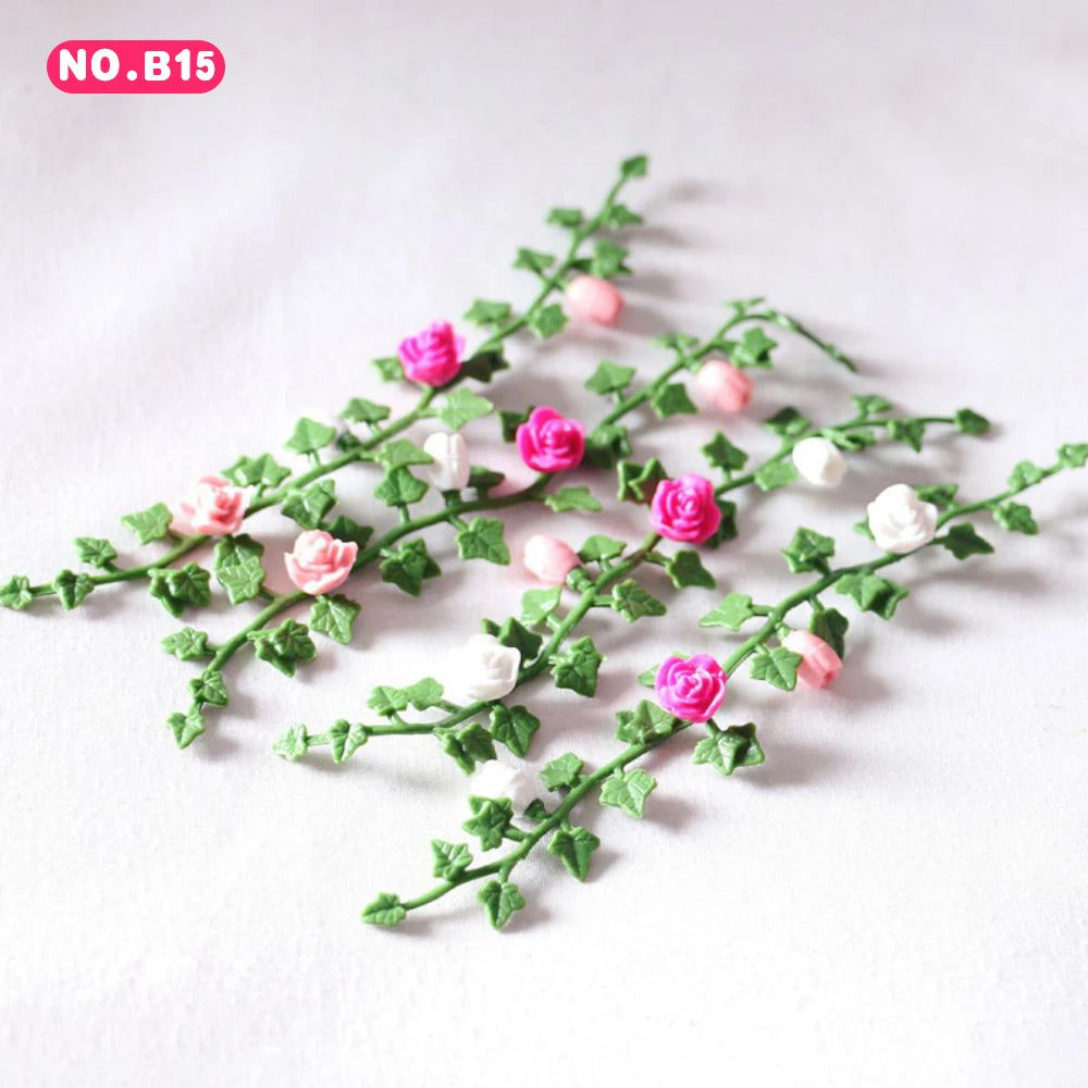 Green foliage with pink and white roses used as a decorative element.