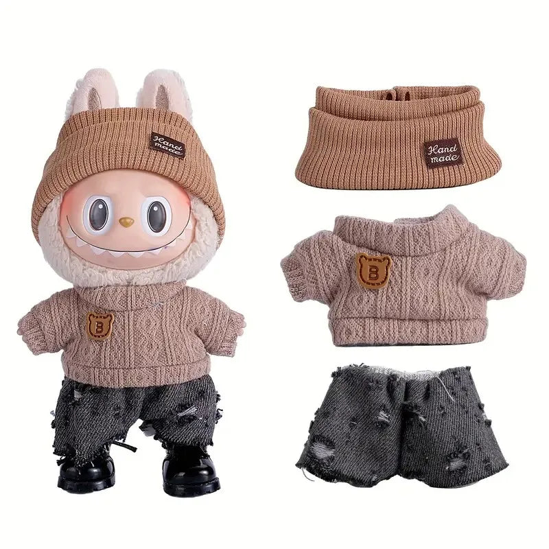 A set of knitted sweater and pants for a doll figure, featuring beige and brown tones.