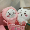 A pink Usagi Hachiware plush keychain in a pajama theme is shown inside a pink basket.