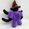 A black plush toy with a brown witch hat and purple body featuring a star design on the chest.