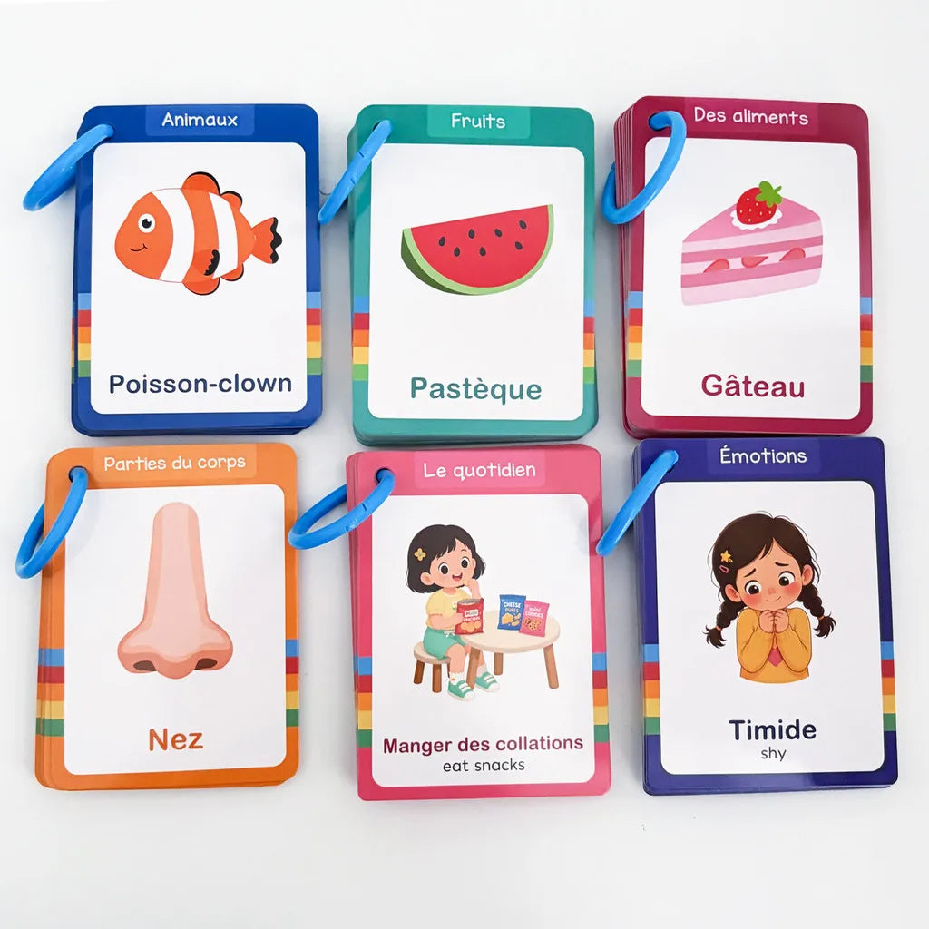 Six colorful flash cards featuring French and English vocabulary related to fish, pastry, food, nose, and emotions.