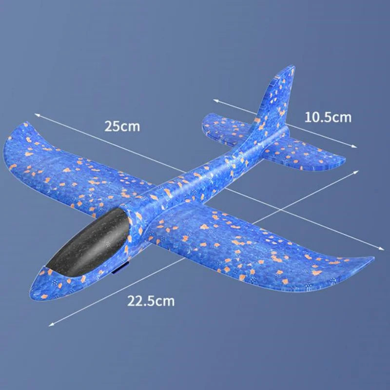 A blue foam glider catapult toy gun with wings and a fuselage, shown in a side view.