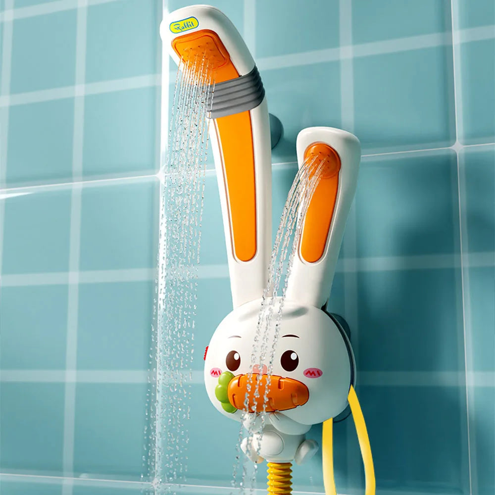 A white rabbit-shaped electric bath shower toy spraying water in a tiled bathroom setting.