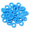 A pile of bright blue acrylic doughnut spacer beads for jewelry making