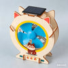 A wooden model kit of a lunar rover featuring a fan and a solar panel on its top.