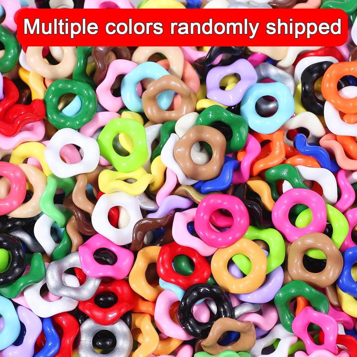 A pile of multiple colors of wave-patterned acrylic beads for jewelry making
