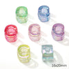 A collection of colorful, translucent acrylic alphabet beads in various shades of green, blue, and pink.