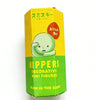 A yellow box of Hippers decorative mini figures with an Attach Me sign and a glow-in-the-dark theme.