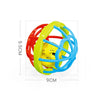 A yellow soft baby grasping ball rattle with a red and blue ring structure.