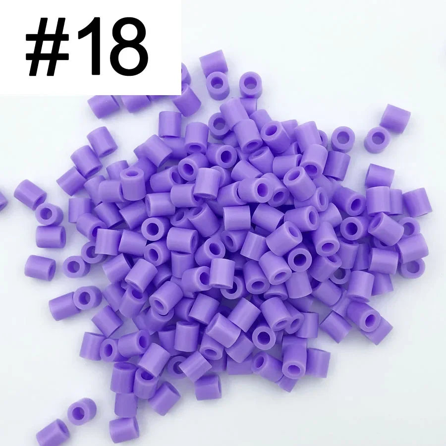 A pile of 1000 purple DIY fuse beads for creative craft projects.