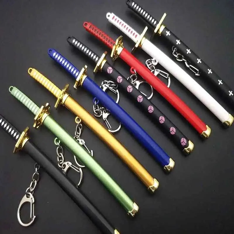 A collection of nine samurai sword keychains featuring various blade designs and colors like black, red, white, and purple.