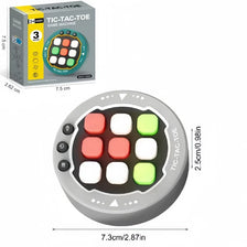 A round Tic-Tac-Toe game machine with colored buttons and a clear plastic top view.