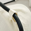 A close-up of a beige breathable cotton muslin car seat cover with a black strap.