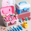 A pink and white kids doctor role play set with various medical tools and a blue storage box.