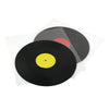 A black vinyl record is shown resting on a clear protective sleeve with a red label visible.