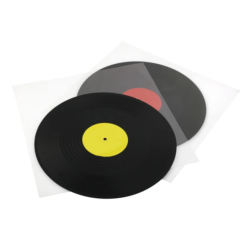 A black vinyl record is shown resting on a clear protective sleeve with a red label visible.