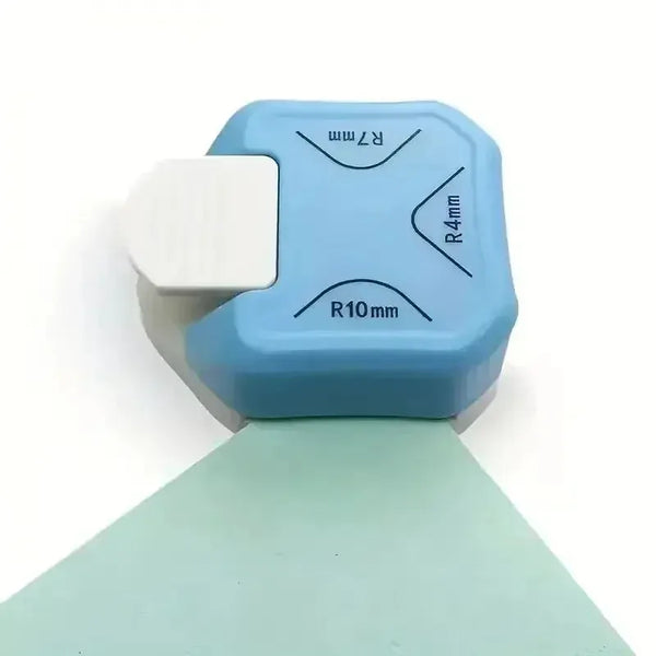 A light blue plastic corner embosser and cutter kit with various radius markings.