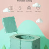 A light green folding toilet portable potty training seat displayed on a white stand.
