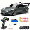 A dark gray 4WD RC drift car with LED lights, a remote control, and various accessories are displayed.