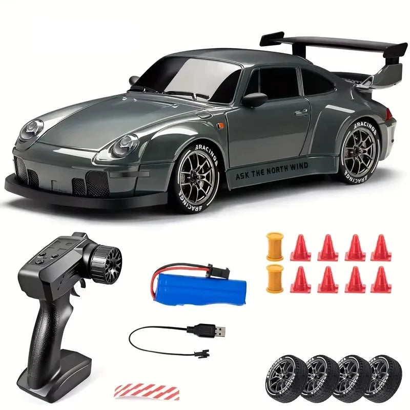 A dark gray 4WD RC drift car with LED lights, a remote control, and various accessories are displayed.