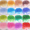 A collection of brightly colored glass rice beads in various shades including yellow, orange, blue, green, pink, and purple.