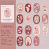A collection of vintage floral stickers in various shades of pink and green for scrapbooking and journaling