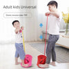 An adult is using an elastic tension tube to assist a child in a frog jump exercise.