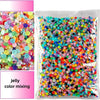 Bag of AB-Coated flat back resin rhinestones in various bright colors for crafts and DIY projects