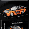 An orange and black RX7 sports car model kit displayed in various views showing its size and features.