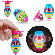 A hand holds a glowing spinning top toy with colorful LED lights, showing its design and illumination.