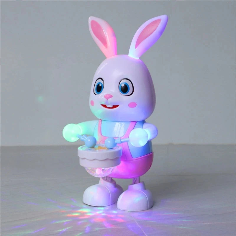 A pink and white musical robot rabbit toy with glowing eyes and features, standing on a surface.