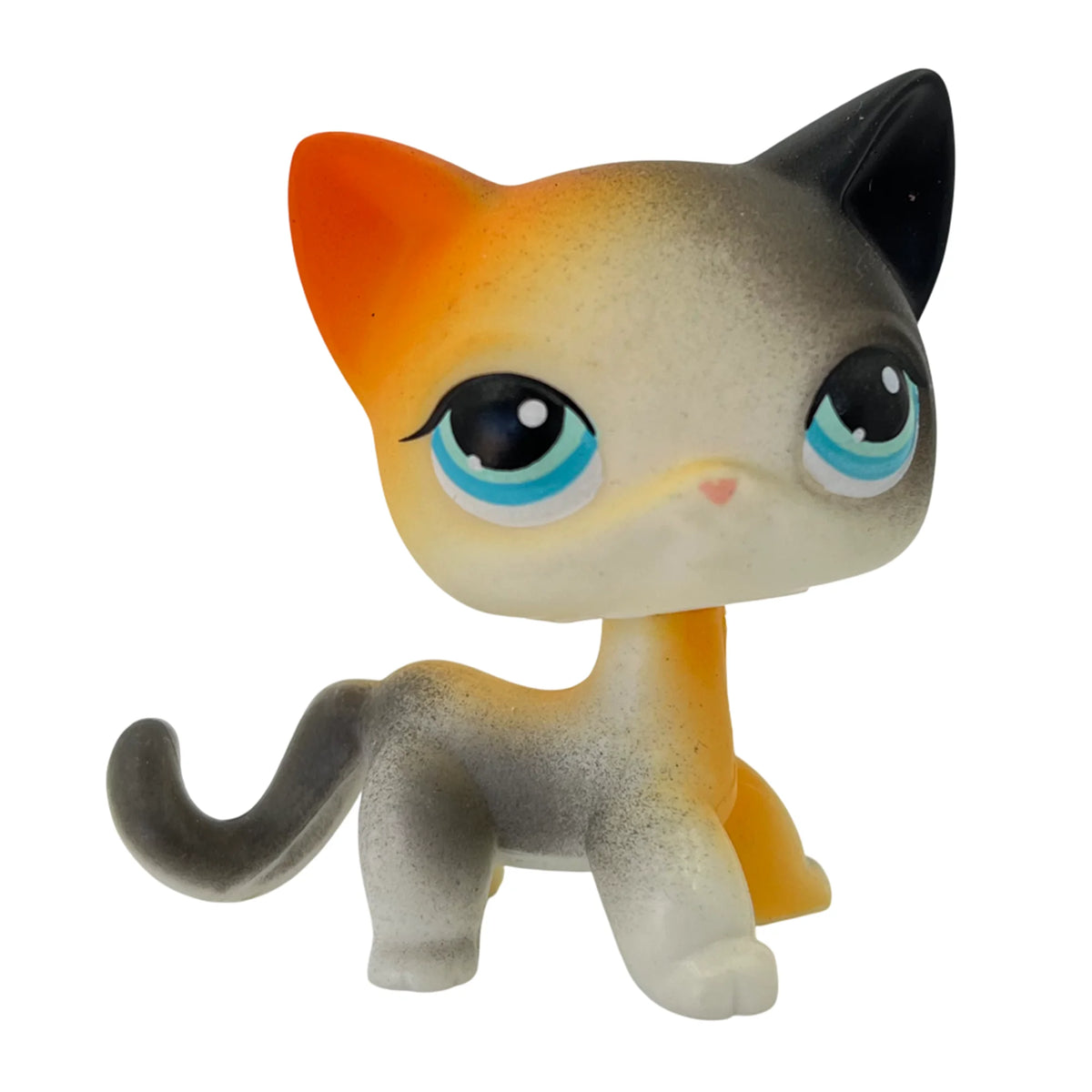 A charming bobblehead figurine of a kitten with orange and gray fur and blue eyes.