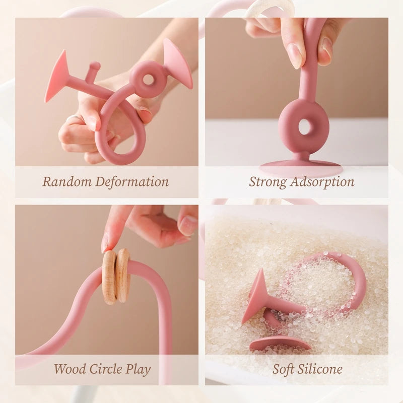 A collection of pink silicone teething toys demonstrating random deformation, strong adsorption, wood circle play, and soft s