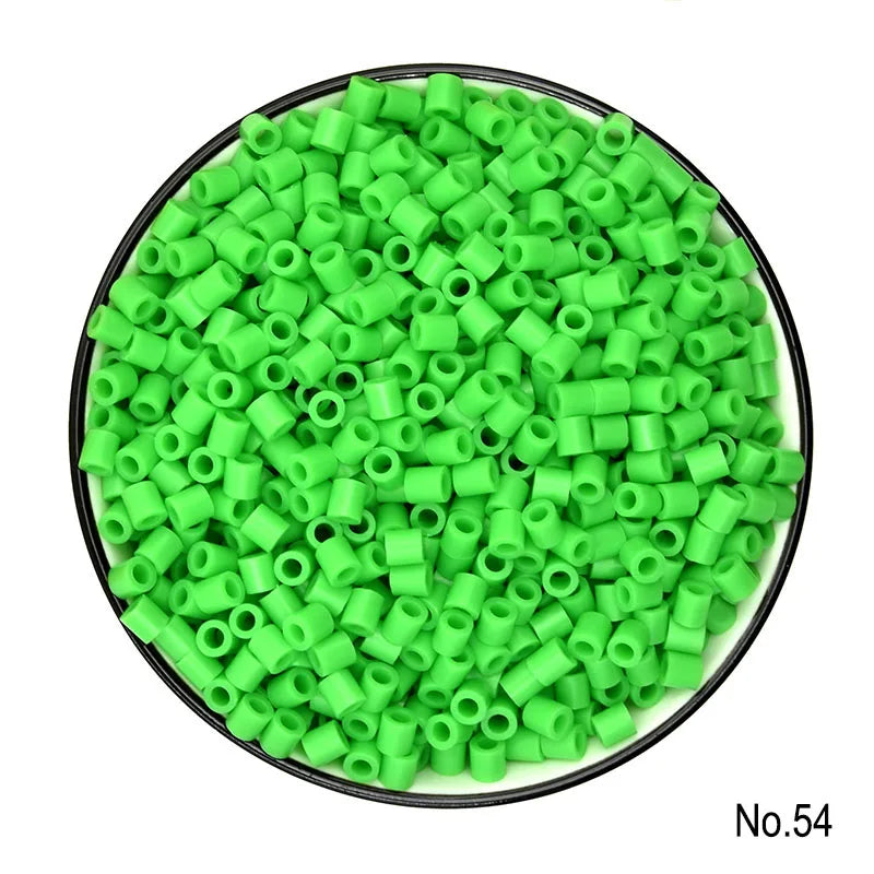 A pile of bright green creative fuse beads used for pixel art puzzles.