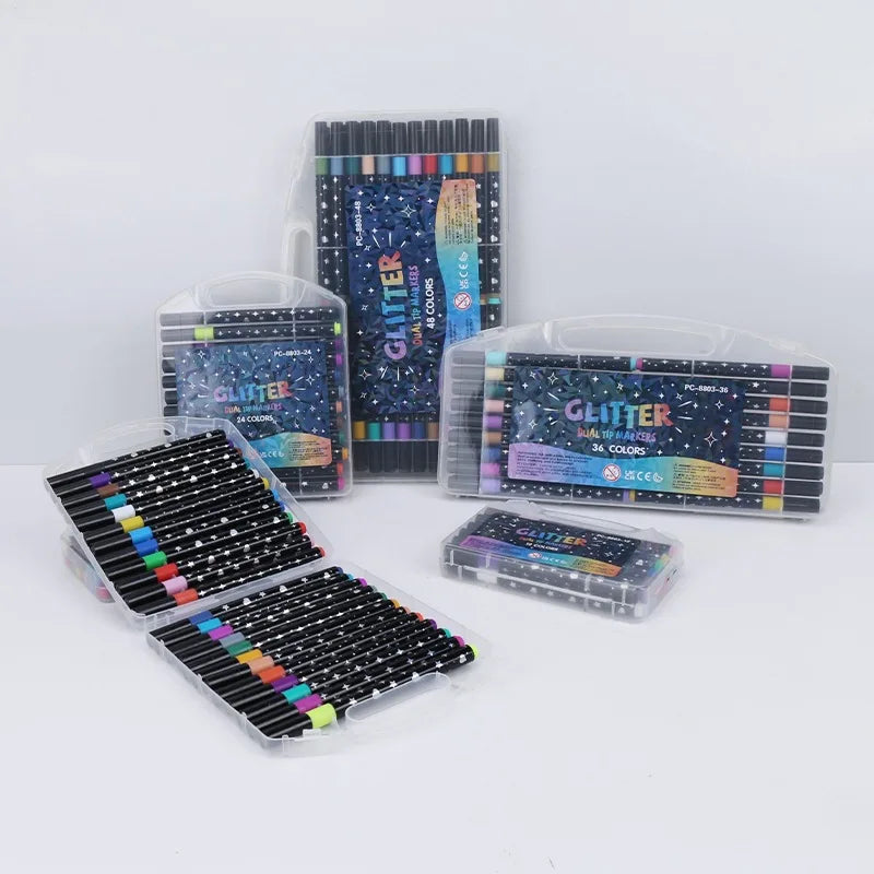 A collection of dual brush tip glitter markers in various colors and metallic shades displayed in packaging.