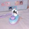 A light blue and purple collectible keycap blind box featuring a character with black hair and white hair.