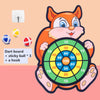 An orange cartoon fox character holding a green dart board with various colored sticky balls and a hook.