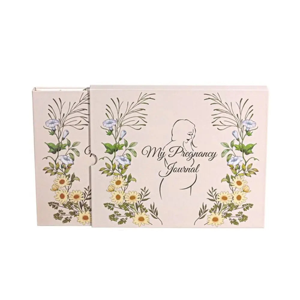 A pink memory book for pregnancy journey featuring floral illustrations and an exam tracker.