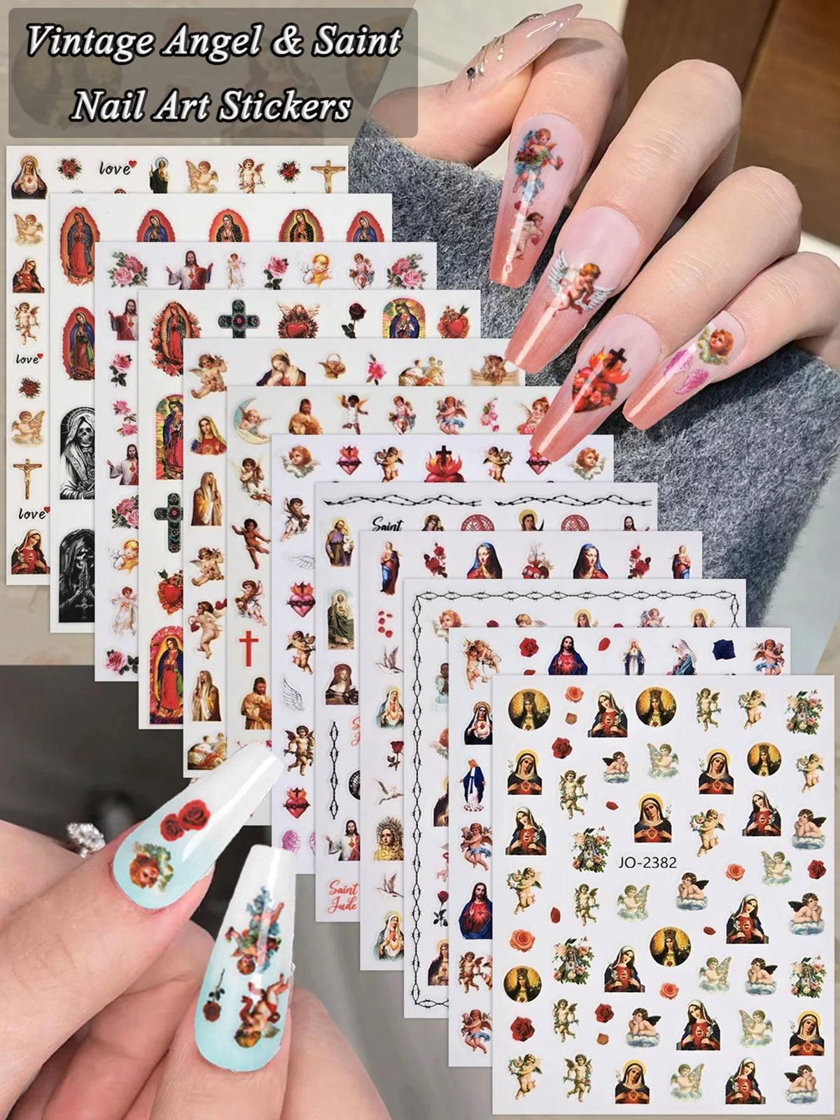 A hand displays vintage angel and saint nail art stickers featuring cherubs, religious figures, and crosses on a nail bed.
