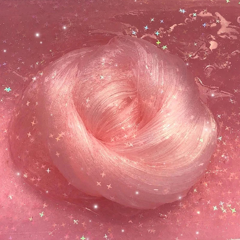 A pink, swirling slime is shown against a reddish background with sparkling effects.