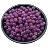 A bowl filled with small, round, purple acrylic beads for jewelry making.