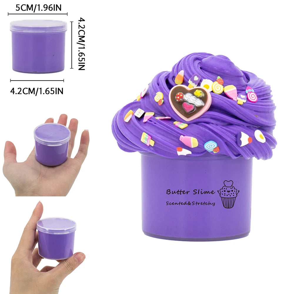Purple butter slime with dinosaur and cake designs being stretched on a purple container.