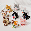A collection of cat-themed miniature building blocks in various colors and styles.